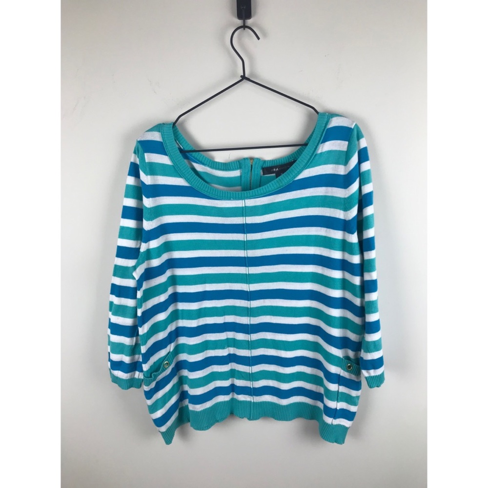 Stripped sweater with zip up in back